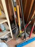 Corner lot: push broom, pick, rakes, lopper, shovel