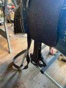 Fancy tooled leather saddle, saddle blanket,  and stand