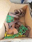 Contents of shelf: archery arrows and supplies
