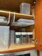 Contents of two shelves: plastic storage containers