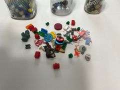 Jars of marbles, dice, and trinkets