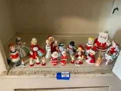 Contents of shelf: vintage china Santa and other Christmas figurines