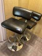 Two chrome and black upholstered bar stools - by the pc take two