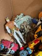 Toy lot including: Spider-Man car, WWE Sin Cara action figure, Transformers, misc