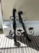 Pair of wrought metal double candle wall sconces