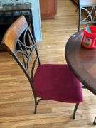 Wrought metal base table w/ round wooden top and set of four matching chairs w/ padded seats 44x44x30