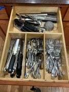 Contents of drawer: flatware, utensils