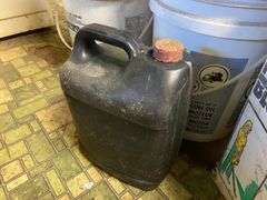Yard blower in box, plastic kerosene can, antifreeze, motor oil, work gloves, misc
