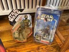 Star Wars collectibles including: VHS tapes, figures, CommTech reader, Darth Vader watch