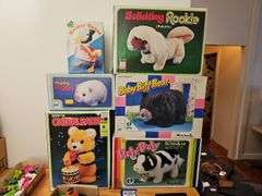 Wind-up and battery op toys in boxes including: Mother Goose, dog, pig, bears, calf