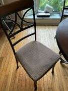 Wrought metal base table w/ round wooden top and set of four matching chairs w/ padded seats 44x44x30
