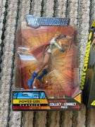 Two action figures in packages: Power Girl and Nite Owl