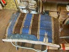 Fancy tooled leather saddle, saddle blanket,  and stand