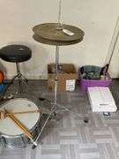 Snare drum, hi-hat cymbal, First Act guitar, two stools