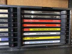 Contents of shelf: Faces of Death VHS box set, music CDs in case