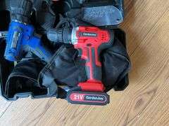 Cordless tool kit: two drills, mini chainsaw, charger