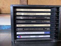 Contents of shelf: Faces of Death VHS box set, music CDs in case