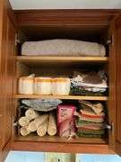 Contents of bath/laundry room: Bath stool, towels, heath & body products, walker, under sink contents, wall plaque, misc. Washer and Dryer NOT FOR SALE.