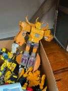 Toy lot including: Spider-Man car, WWE Sin Cara action figure, Transformers, misc