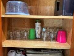 Contents of two cupboards: mugs, glasses, stemware, Halloween bowls, misc