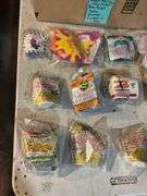 Large lot of vintage Happy Meal toys in packages including: Power Rangers, Flintstones, Barbie, Nintendo