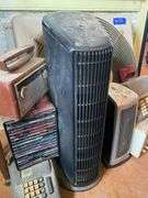 End stand, brass vanity mirror, metalware, vintage Zenith portable radio, GE plastic table radio, Cds, vintage adding machines, electric fans25.5x17.5x31