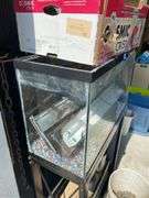 Aquarium on stand and two other aquariums, and accessories