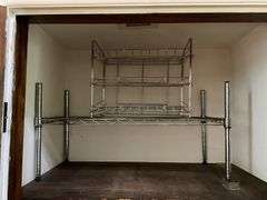 Contents of closet: hand weights, wire shelving, luggage, bags, misc