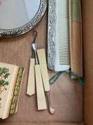Silverplated hand mirror and comb, celluloid vanity tools, box w/ lambs on top, folding fan