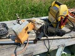 Wooden nesting box and contents: jump started, extension cords, coal bucket, buckets, replacement window, tools, misc