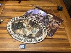 Three metal wolf plaques