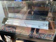 Aquarium on stand and two other aquariums, and accessories