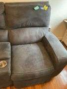 Gray double power recliner w/ central cup holders & USB jacks, 6 ft wide - no contents