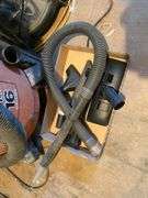 Two Craftsman shop vacs, fire extinguishers, package tape handle