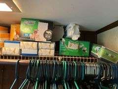 Contents of closet: MooSoo vacuum, Hoover upright vacuum, hand vac, cleaning supplies, Swiffer and refills, drawer unit, metal shelf unit, hangers, misc