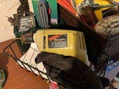 Black & Decker drill, drill bits, trouble light, scrub brush, basket, misc