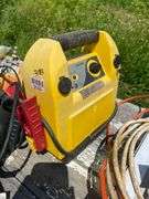 Wooden nesting box and contents: jump started, extension cords, coal bucket, buckets, replacement window, tools, misc