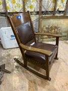Turn-of-the-century oak rocking chair w/ upholstered seat and back panel