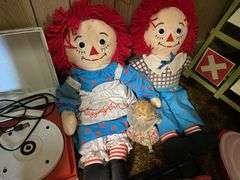 Vintage riding horse and contents of closet: baby scale, toy rifles, child's turntable, Raggedy Ann & Andy dolls, toy cars, misc toys