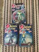 Three Fantastic Four action figures in packages
