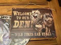 Three metal wolf plaques