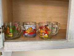Four Garfield glass mugs