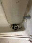 Contents of bathroom: iron, ironing board, rolling stand, waste basket, craft supplies, lightbubls