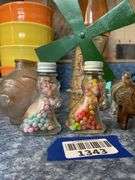 Glass piggy bank and four figural glass candy containers - note damage to barrel wagon