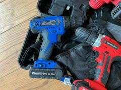 Cordless tool kit: two drills, mini chainsaw, charger