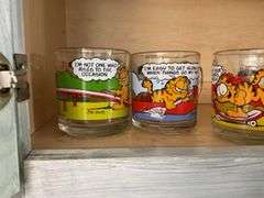Four Garfield glass mugs