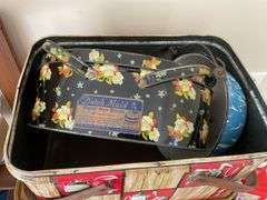 Three decorative lithographed tins, and blue & white swirl graniteware pan w/ bail handle