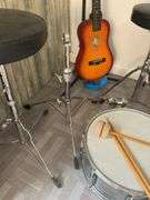 Snare drum, hi-hat cymbal, First Act guitar, two stools