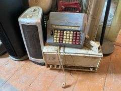 End stand, brass vanity mirror, metalware, vintage Zenith portable radio, GE plastic table radio, Cds, vintage adding machines, electric fans25.5x17.5x31
