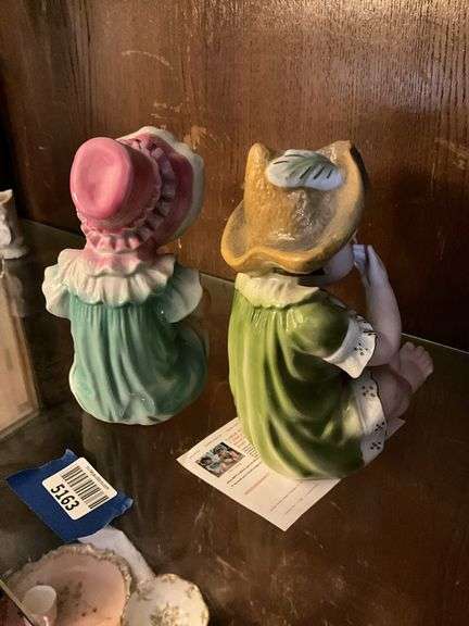 Two bisque piano baby figurines